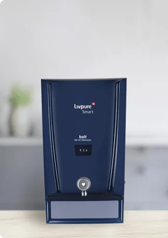 Livpure Smart Bolt RO purifier in dark blue standing on a kitchen counter